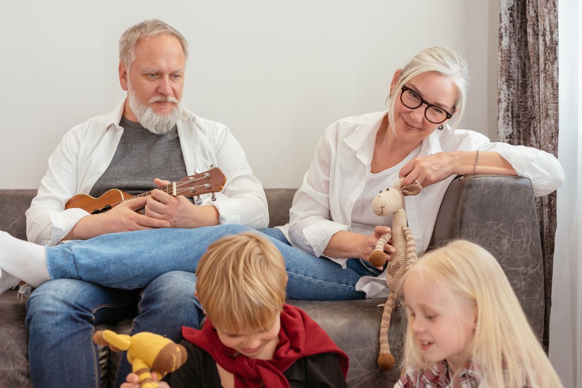 Grandparents spending time with their grandchildren at home