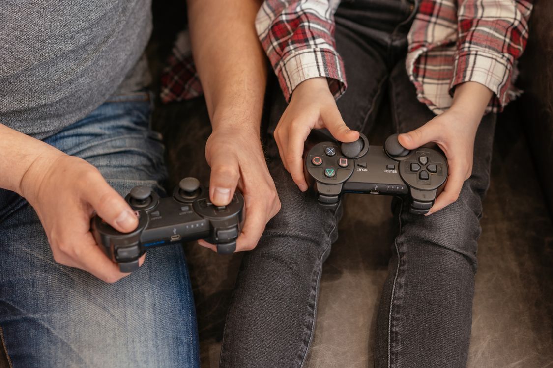 How Parents See A Controller Person and Child Using Joysticks · Free Stock Photo