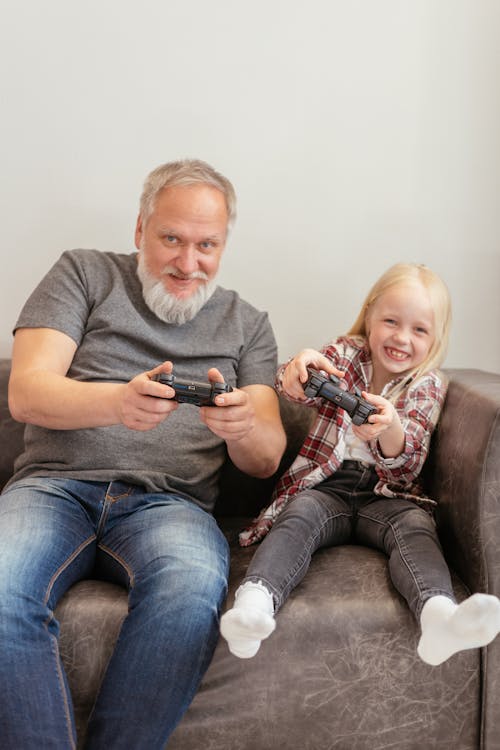 A Man and his Granddaughter Playing Video Games