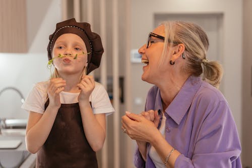 Elderly Woman and Young Girl Having Fun Together 