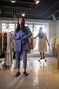 A Stylish Young Woman Standing in a Boutique