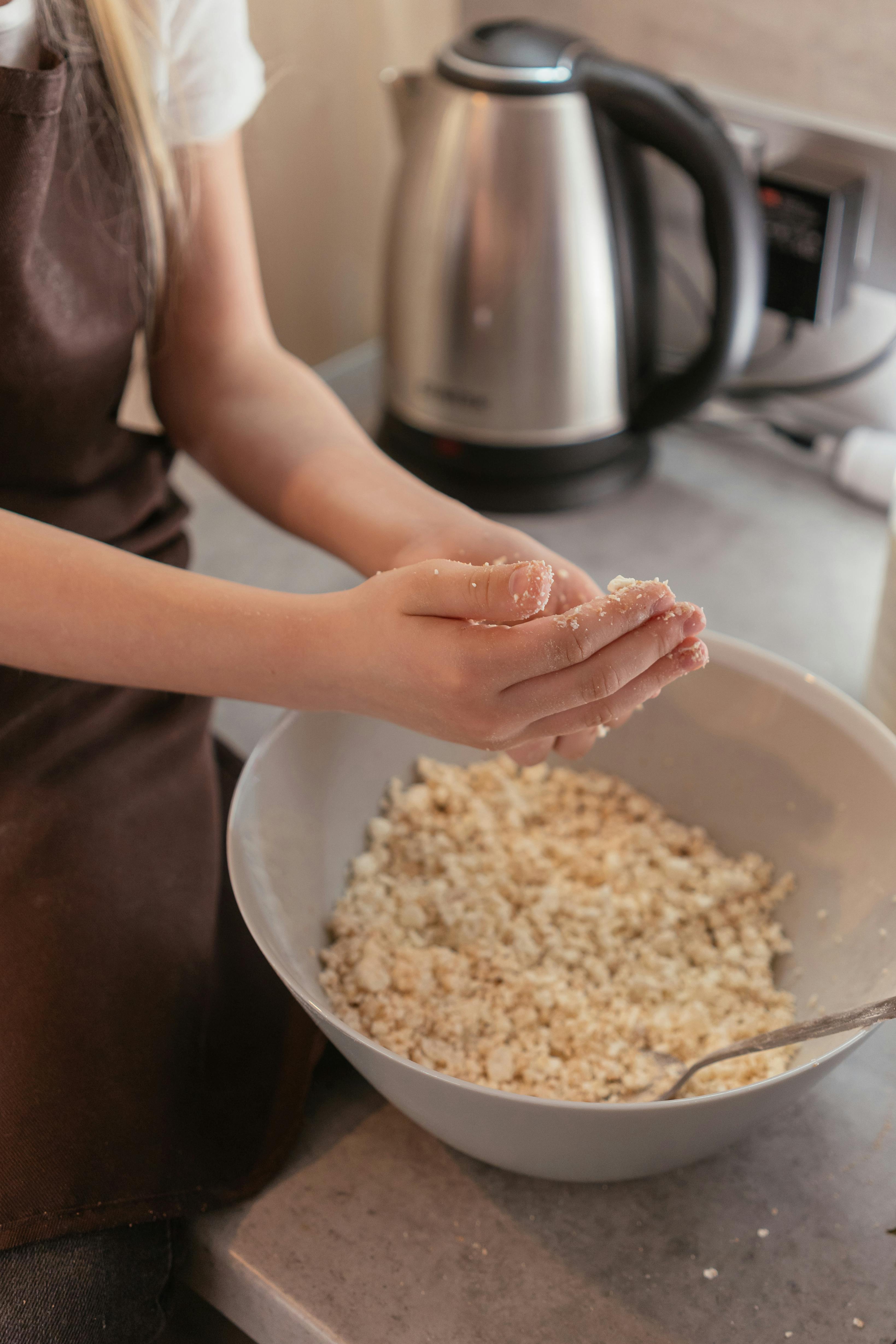 Person Holding White Rice on Stainless Steel Bowl · Free Stock Photo