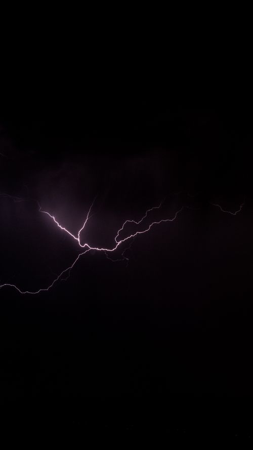 Free Captivating image of a lightning bolt illuminating the night sky. Stock Photo