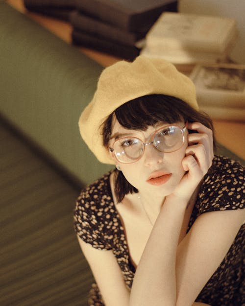 Free A Woman Wearing a Beret Hat and a Pair of Eyeglasses Stock Photo
