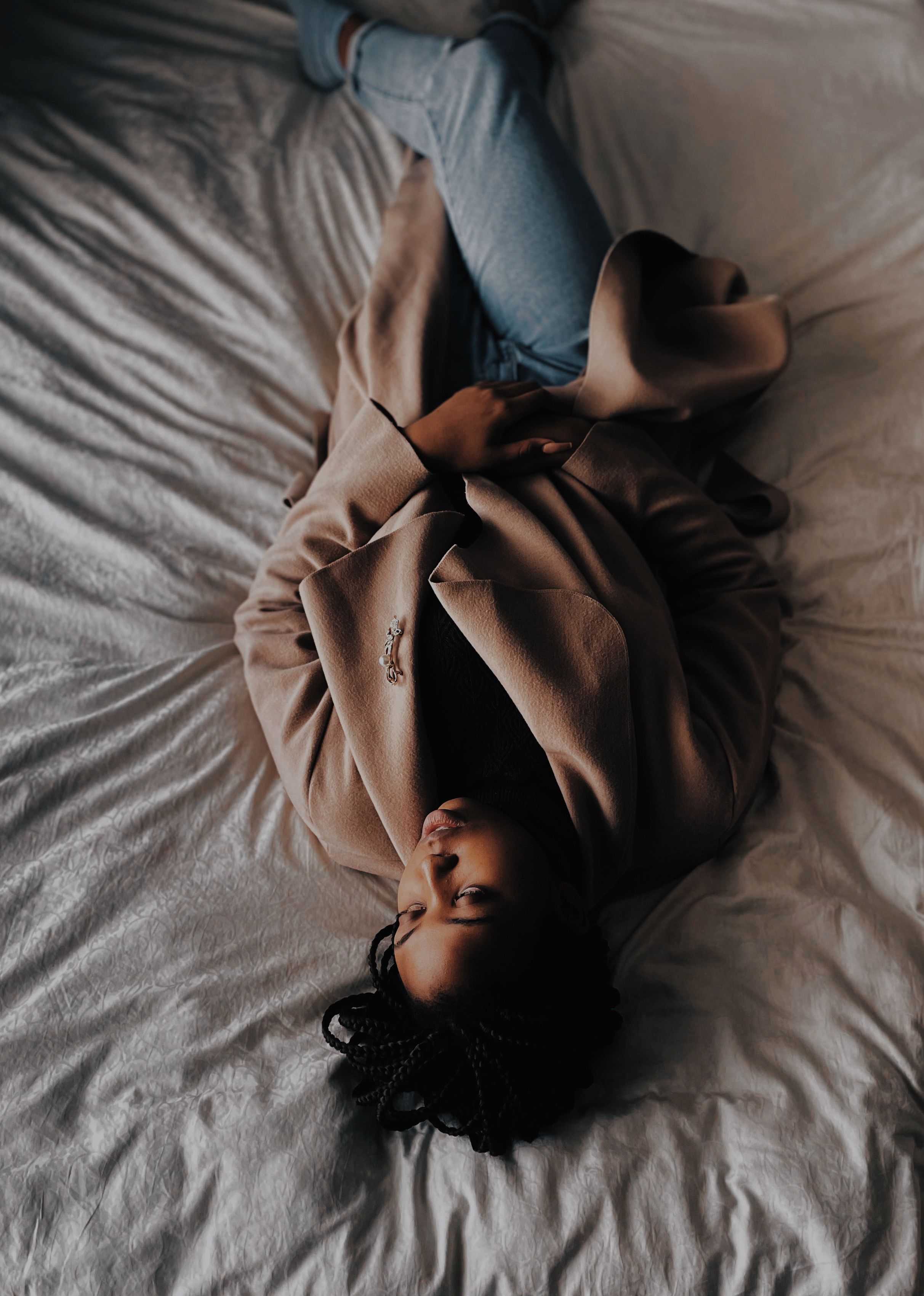 Woman in Black Dress Lying on Bed · Free Stock Photo