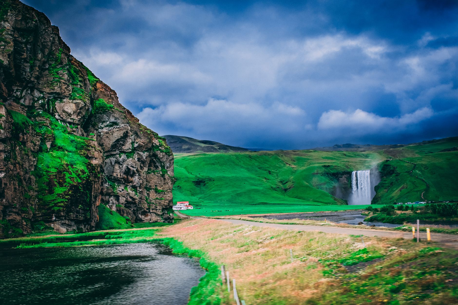 Skogafoss waterfall dropping 60 metres onto black sand