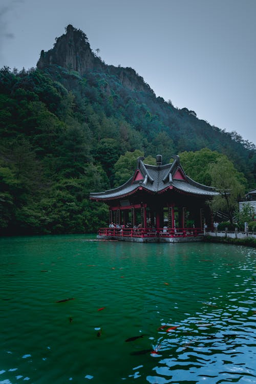 Traditional Pagoda on Water in Nature Landscape