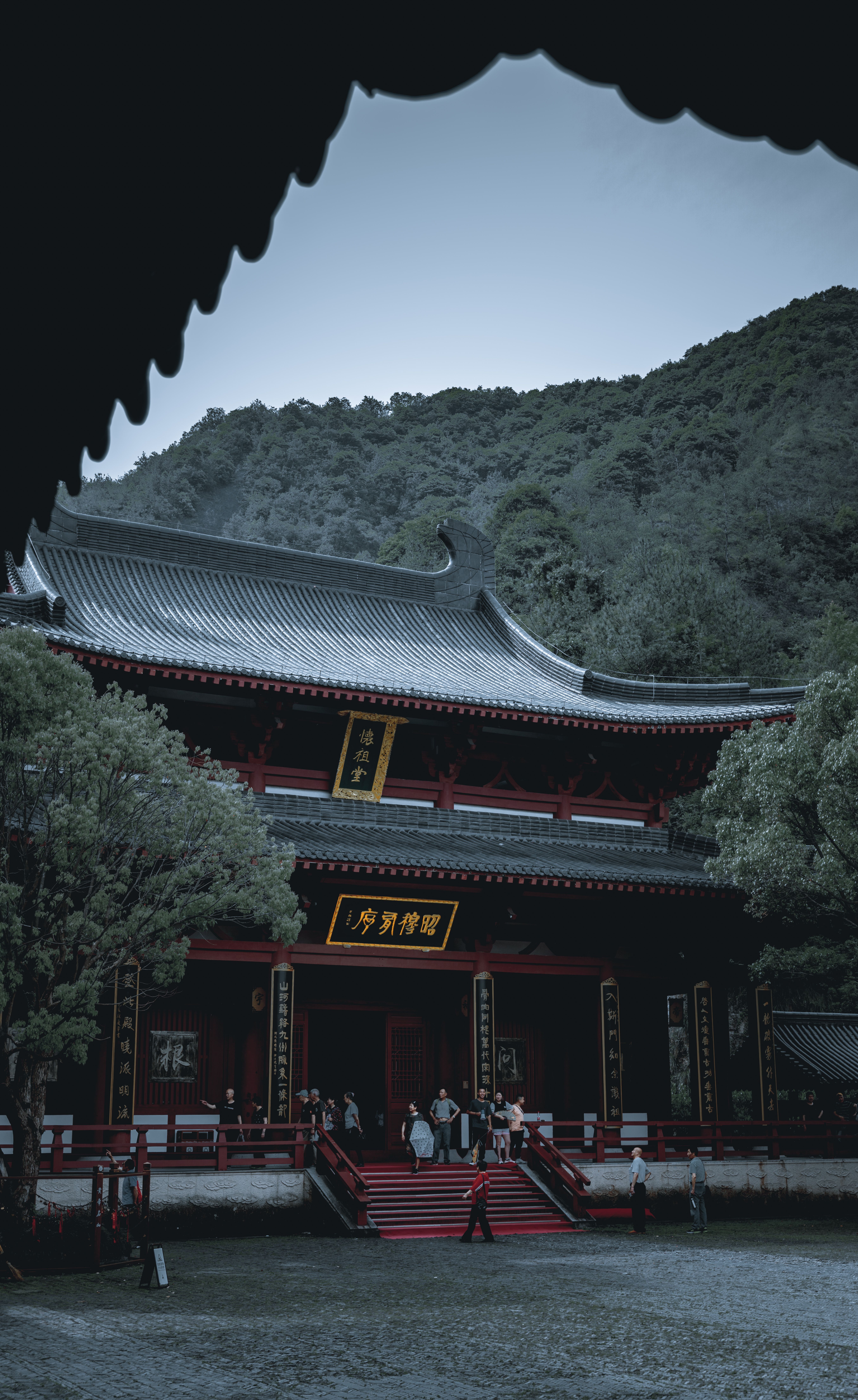 Temple exterior framed by trees in the morning