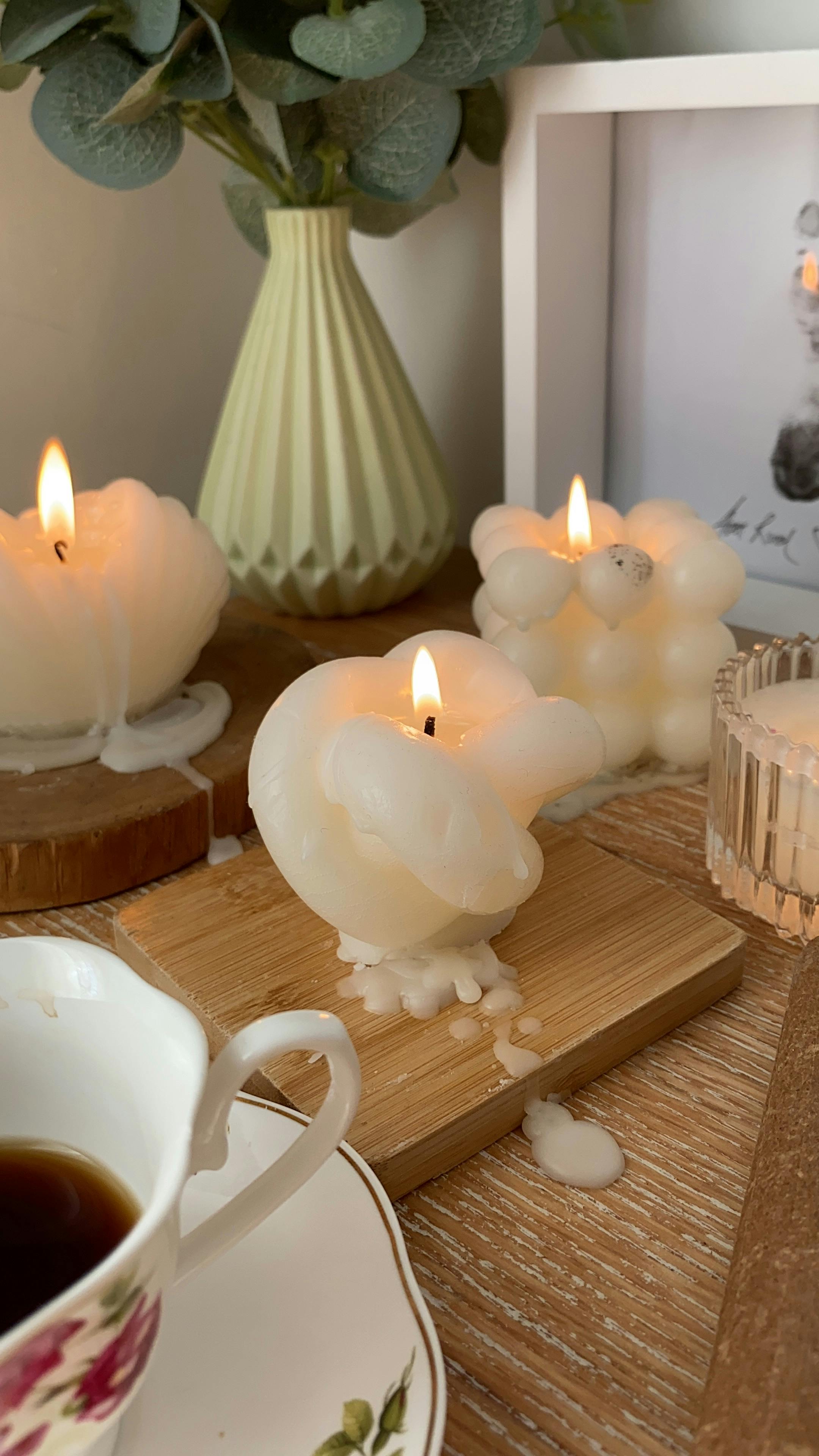 Elegant candlelit scene featuring a coffee cup and decorative elements, perfect for a warm ambiance.