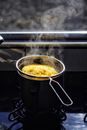 Stainless Steel Cooking Pot With Yellow Soup