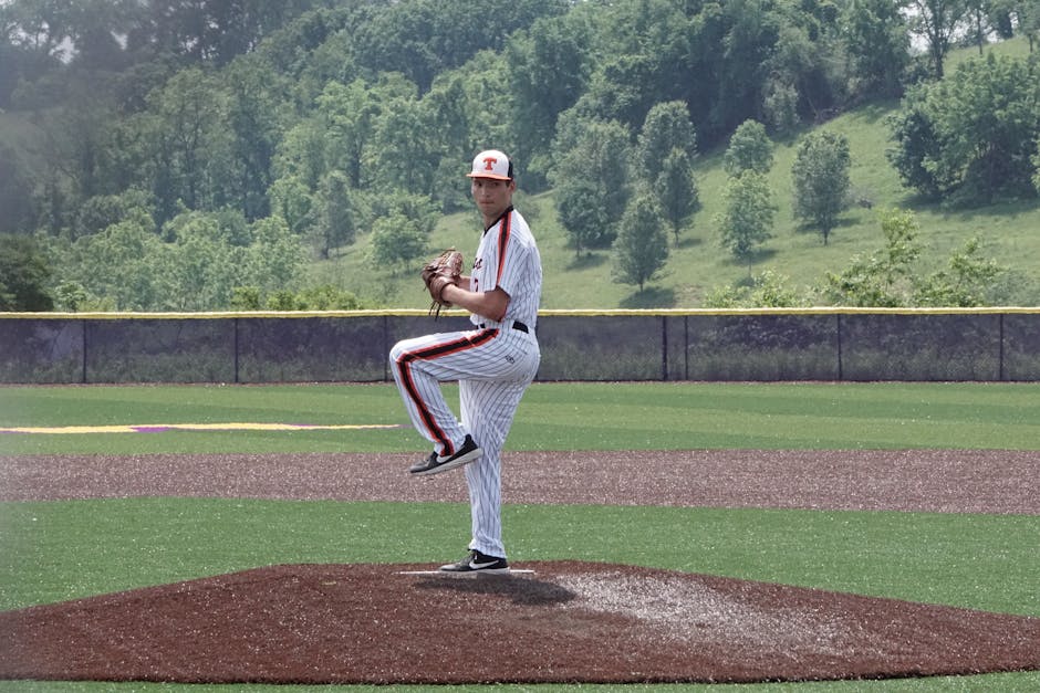 Man Playing Baseball on Field