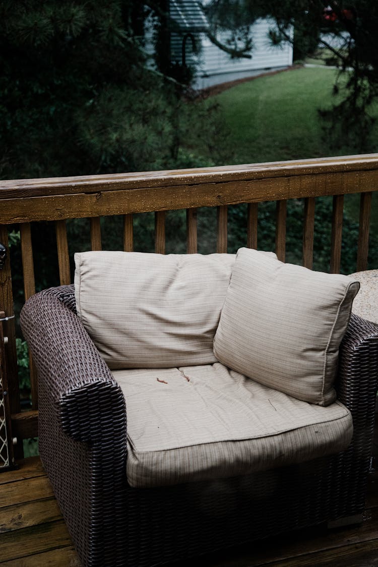 Outdoor Armchair With Cushions On Wooden Deck