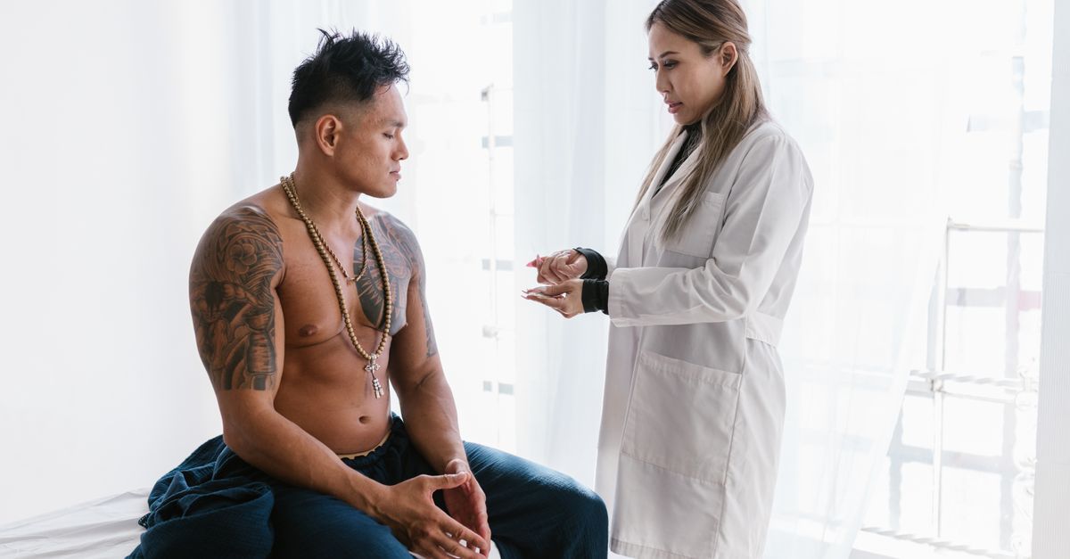 A doctor consulting with a patient in a clinical setting