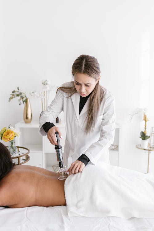 Free Woman Doing Cupping Therapy Stock Photo