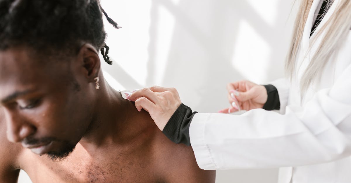A woman receiving a neck massage from a massage therapist.