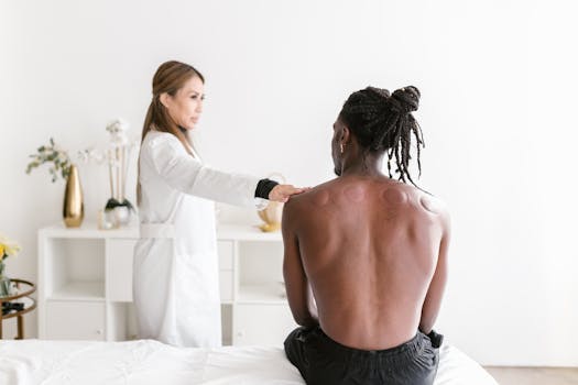 A therapist performs cupping therapy on a man, promoting health and wellness.