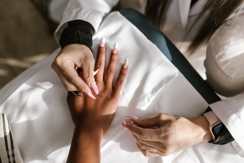 Free Close-up of hands during an acupuncture therapy session for holistic health and wellness. Stock Photo
