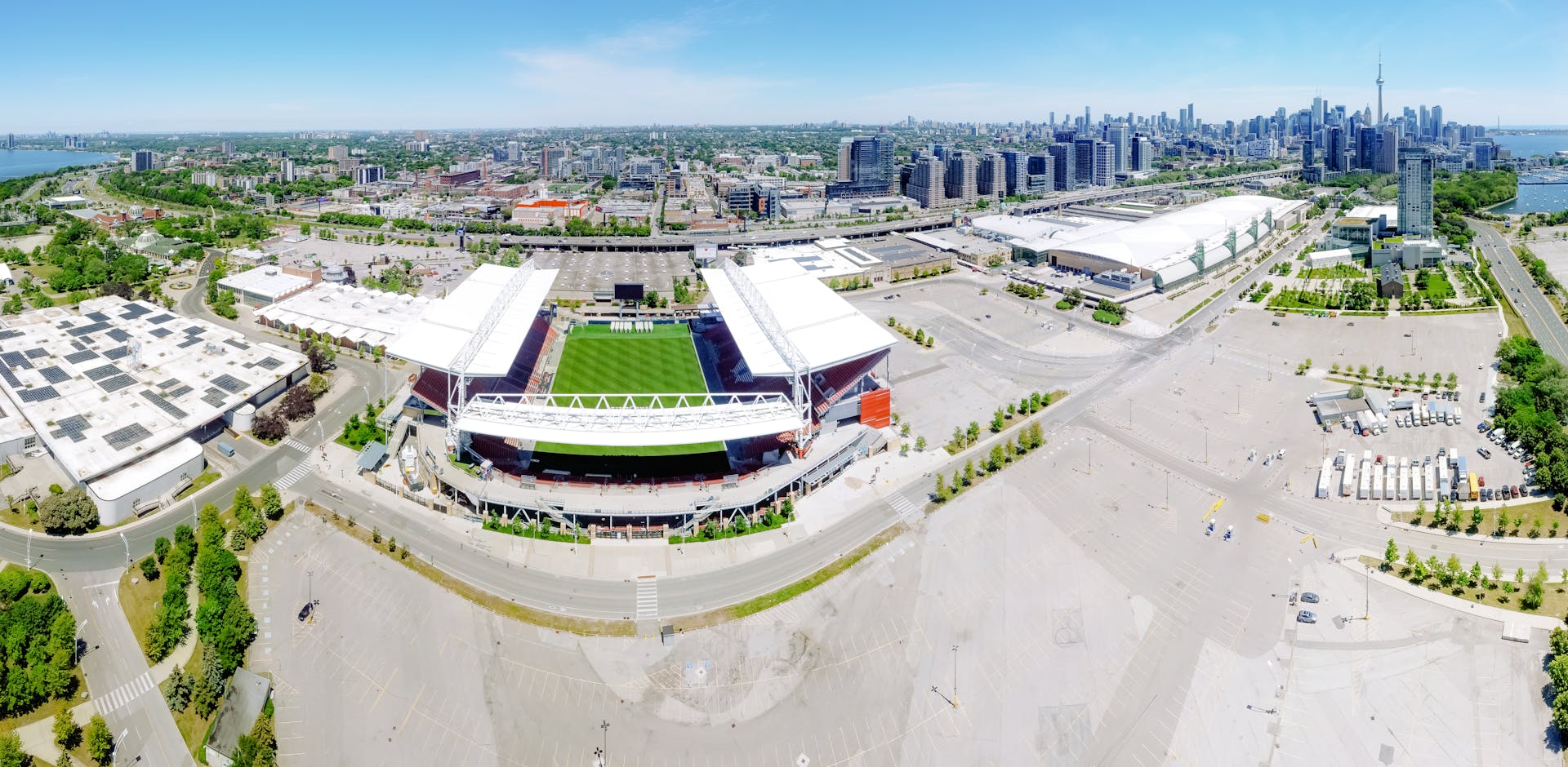 Stunning aerial perspective of Toronto cityscape with BMO Field in foreground.