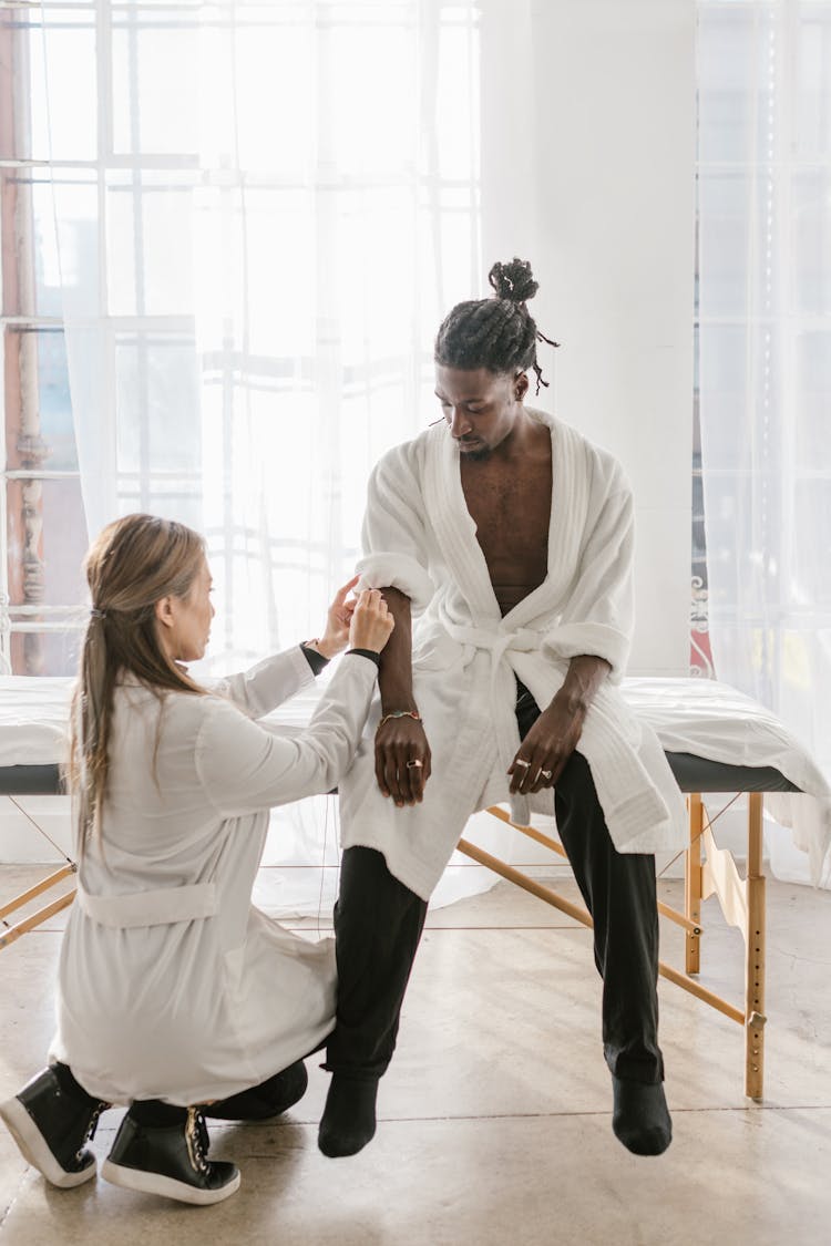 A Therapist Checking Up On Her Patient