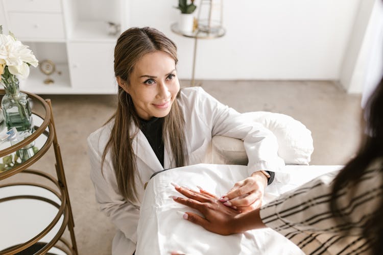 Smiling Woman Doing An Acupuncture