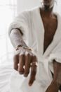 A Man with Needles on His Forearm