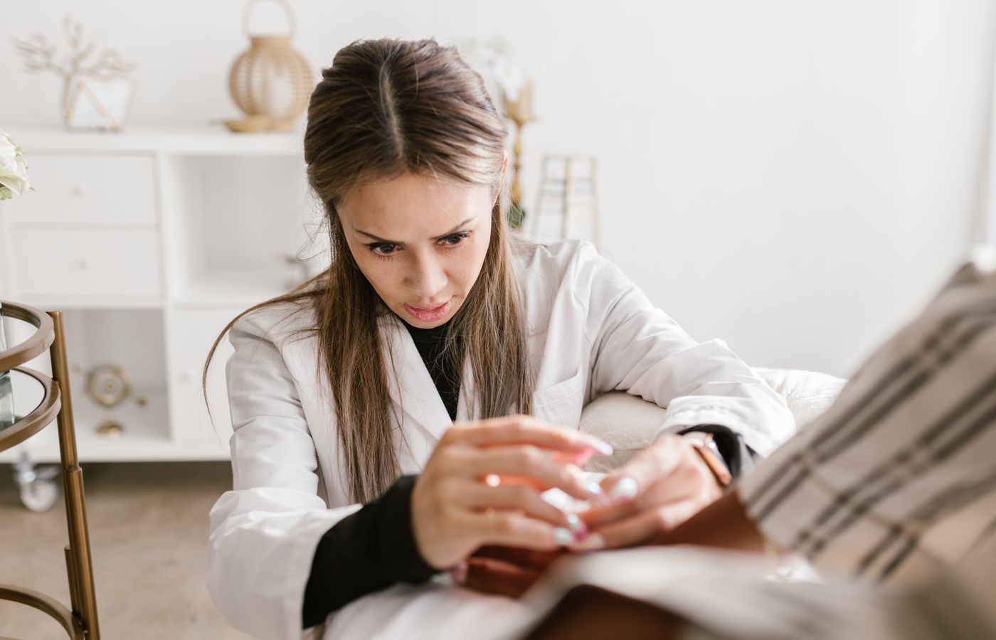 Clinician providing care in a calm modern treatment room