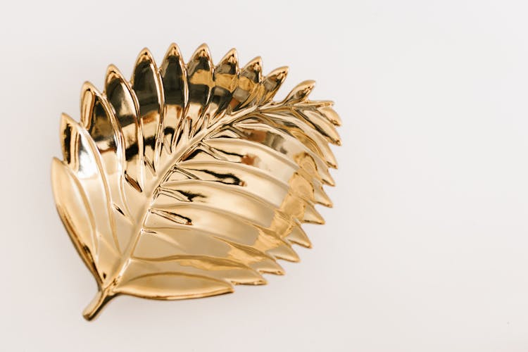 Gold Metal Leaf On White Surface