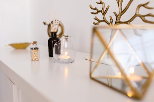 Candle in Glass and Decoration on White Background