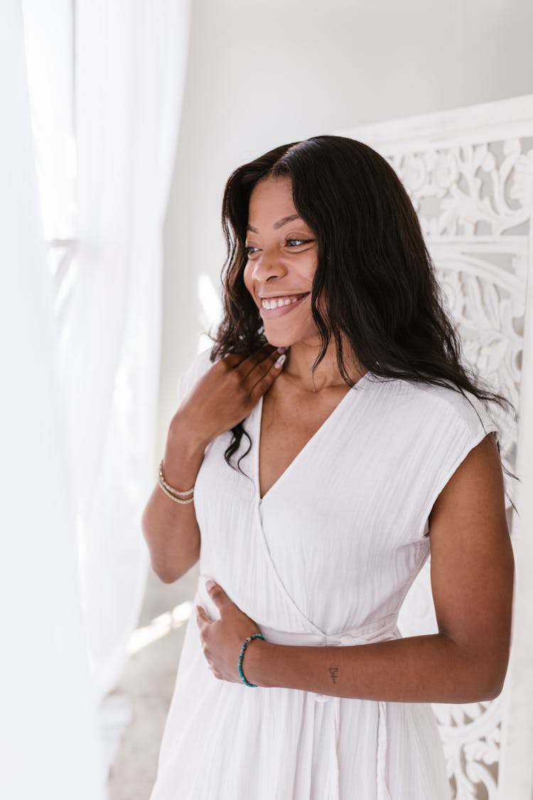 A Woman In White Dress Smiling