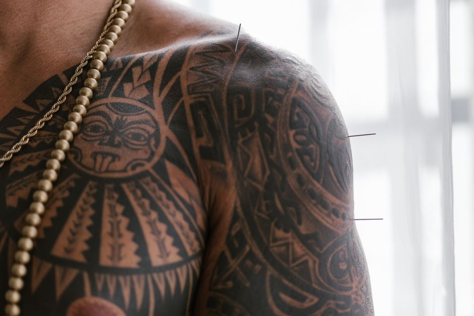 Traditional Polynesian tattoo patterns showing geometric tatau designs on skin Traditional Polynesian tattoo patterns showing geometric tatau designs on skin