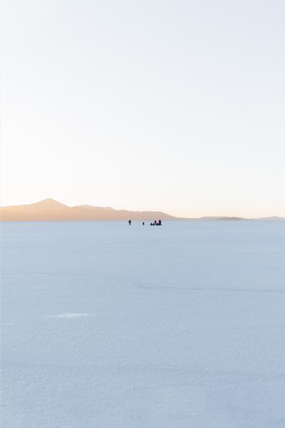 Sunrise over a mirrored salt flat — photo by Kevin Kleber on Pexels