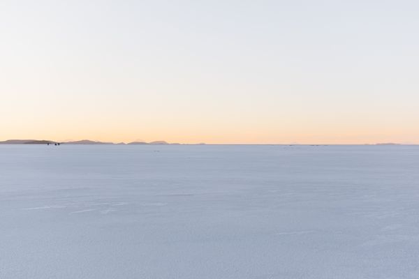 Sunset over a vast salt flat. Photo by Kevin Kleber on Pexels
