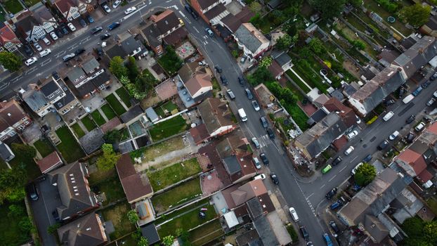 Drone view of suburban residential streets and homes in Luton, England.