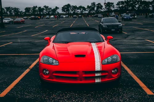 Free Red Convertible Coupe on Black Surface Stock Photo