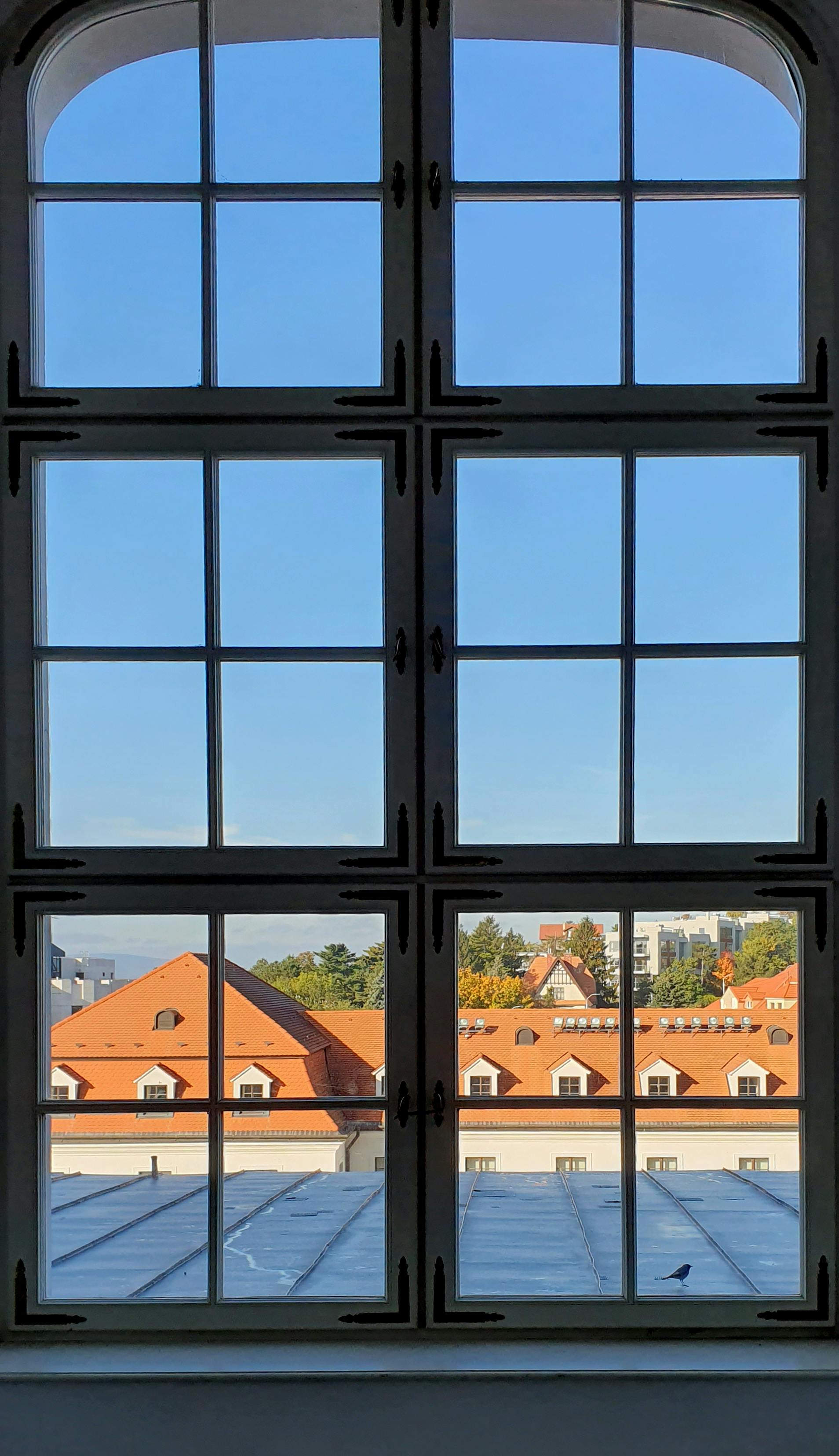 a glass window with a city view