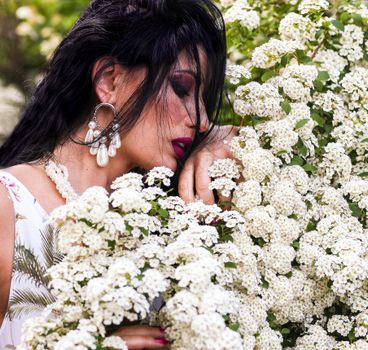 A Woman Near the White Flowers