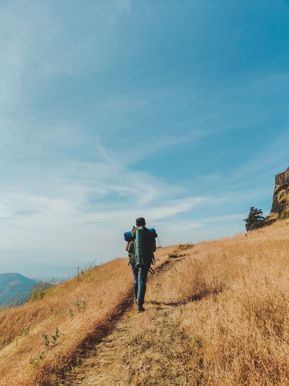 Backpacker pausing on a scenic hiking route