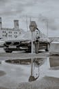 Black and White Photo of a Car Parked at the Parking Lot
