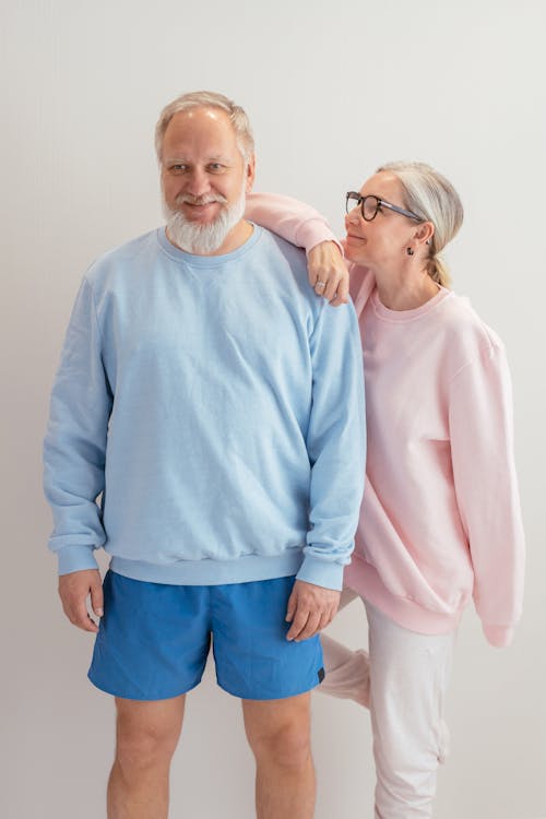An Elderly Couple Wearing Sweaters