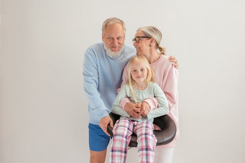 Free An Elderly Couple Together with their Grandchild Stock Photo