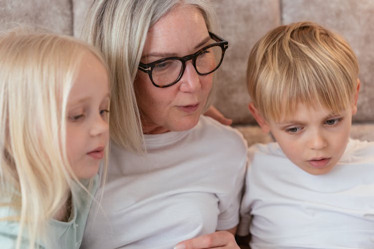 An Elderly Woman Having Conversation With Her Grandchildren