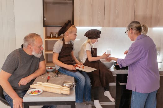 Grandparents cooking with grandchildren in kitchen