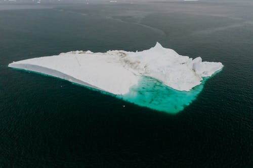 An Aerial Photography of a Glacier in the Middle of the Sea
