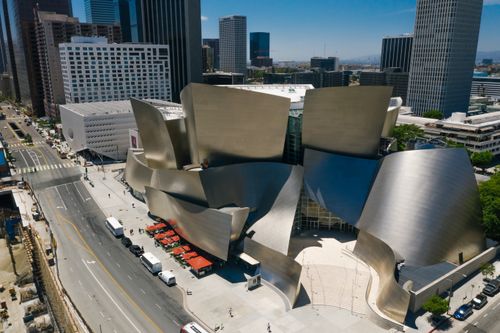 Free Aerial shot of the iconic Walt Disney Concert Hall in downtown Los Angeles, showcasing modern architecture. Stock Photo
