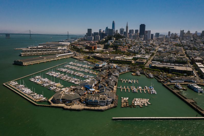 Aerial view of Pier 39 marina with the San Francisco skyline behind