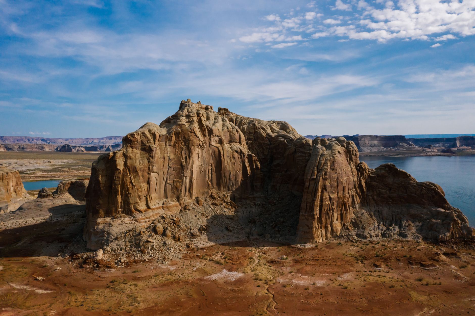 A breathtaking aerial view over eroded rock formations at Lake Powell, showcasing natural beauty and rugged landscapes.