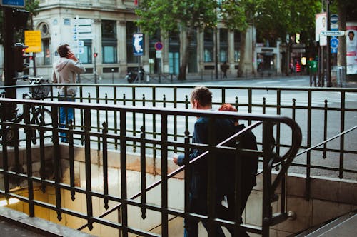 2 Person Walking on Stairs during Daytime