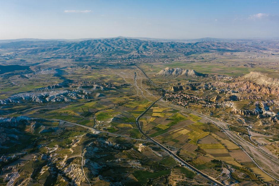 Best Gyrocopter over Pamukkale Travertines & Laodicea Review 2026 - Stunning aerial view of Cappadocia's unique terrain featuring rock formations and fields.