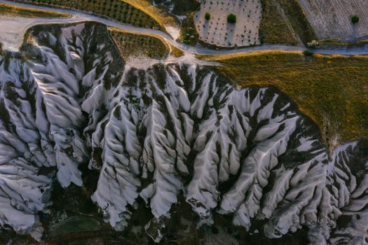 Stunning aerial photo showcasing eroded rock formations in a rural landscape.