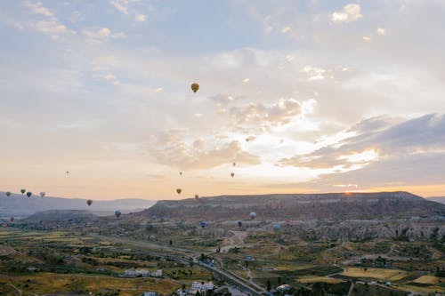 Hot Air Balloons Flying Over the City